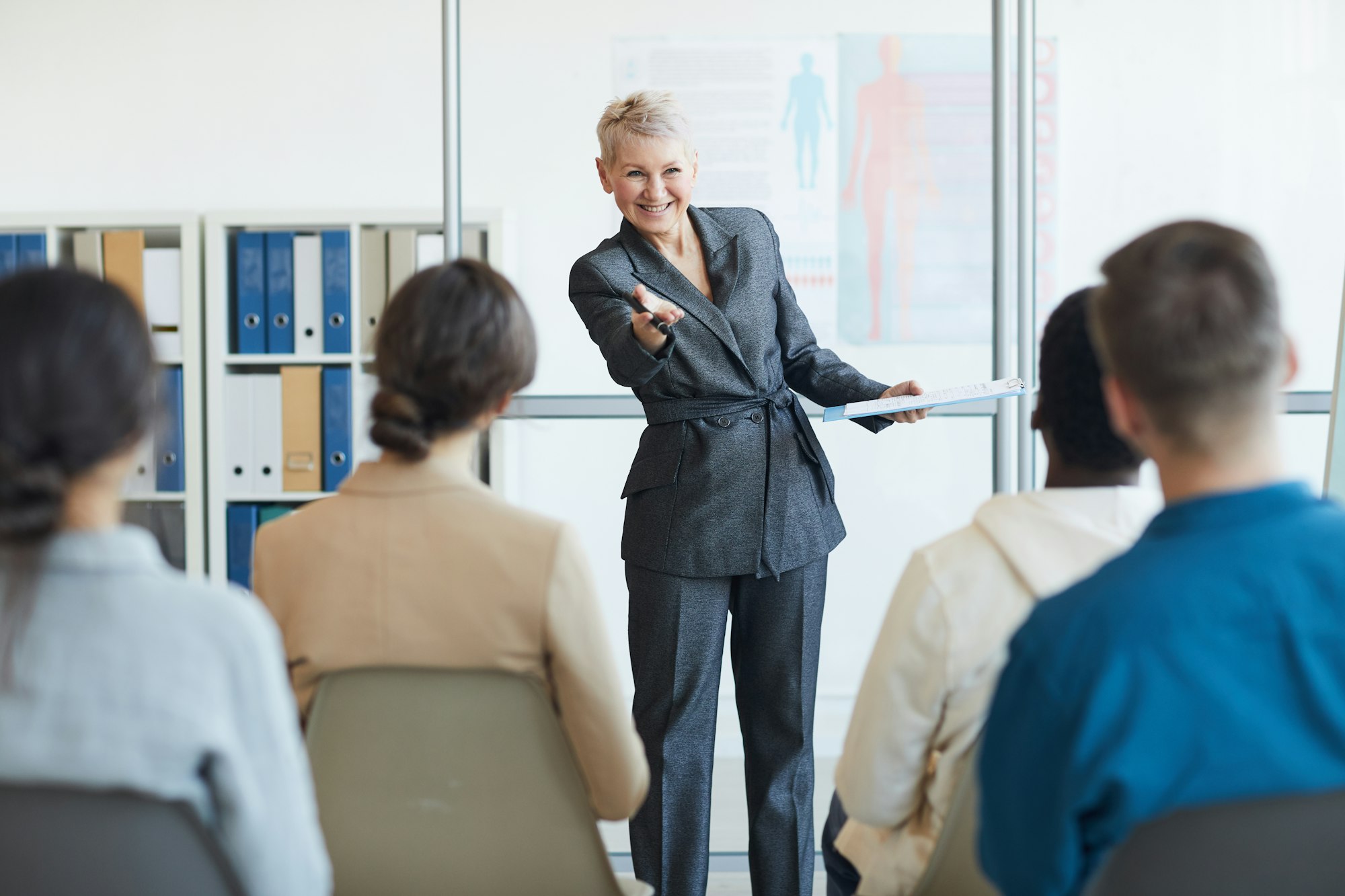 Cheerful Business Coach in Seminar